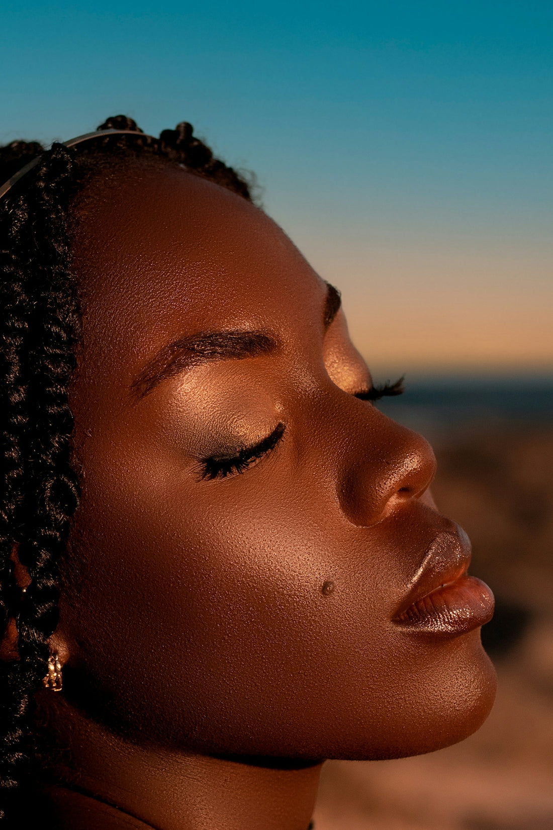 Close-up profile of a woman with eyes closed
