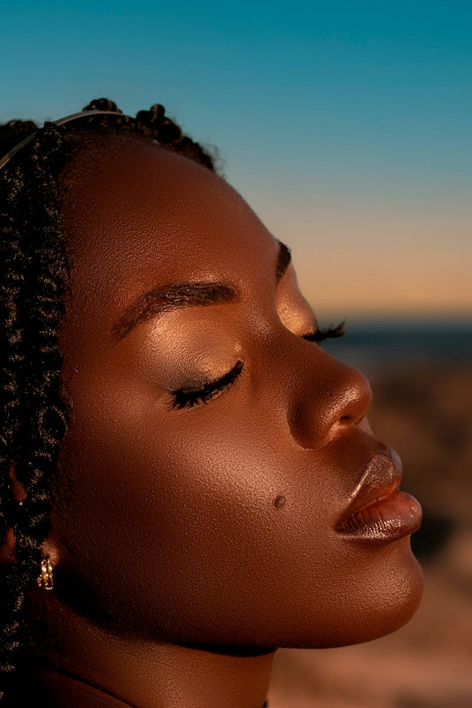 Close-up profile of a woman with eyes closed