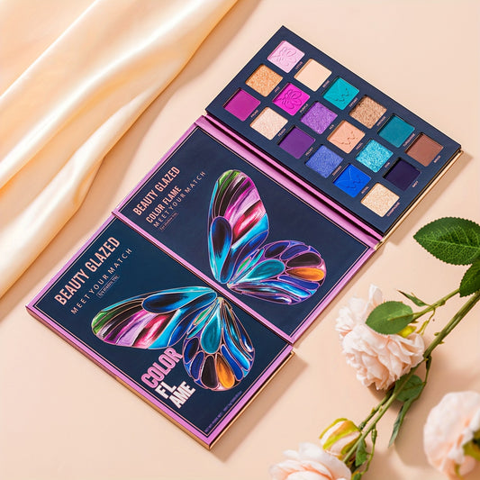 Makeup palette with butterfly design on packaging, surrounded by flowers on a beige background