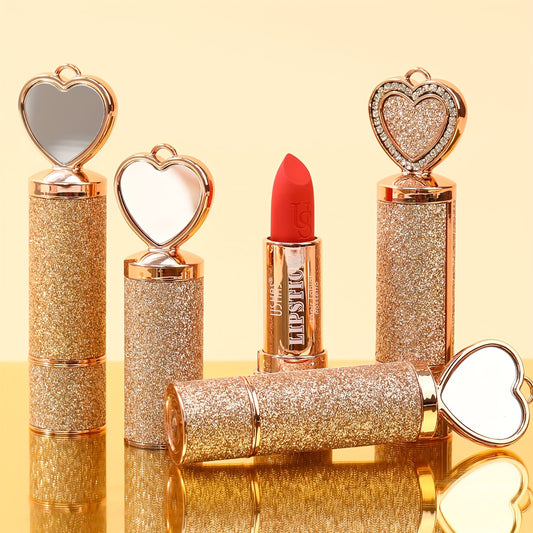 Set of glittery lipsticks with heart-shaped mirrors on a yellow background